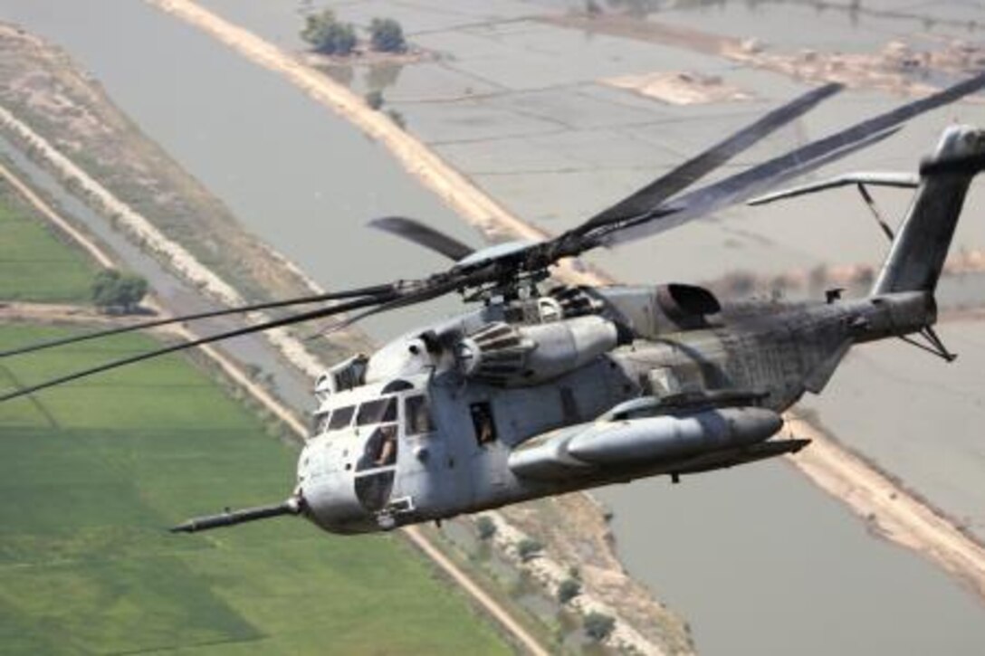 A Marine Corps Super Stallion helicopter from VMM-266 (REIN), 26th Marine Expeditionary Unit flies in route to deliver relief supplies during humanitarian assistance operations in the southern province of Sindh, Pakistan