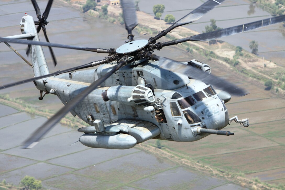 A Marine Corps Super Stallion helicopter from VMM-266 (REIN), 26th Marine Expeditionary Unit flies in route to deliver relief supplies during humanitarian assistance operations in the southern province of Sindh, Pakistan.