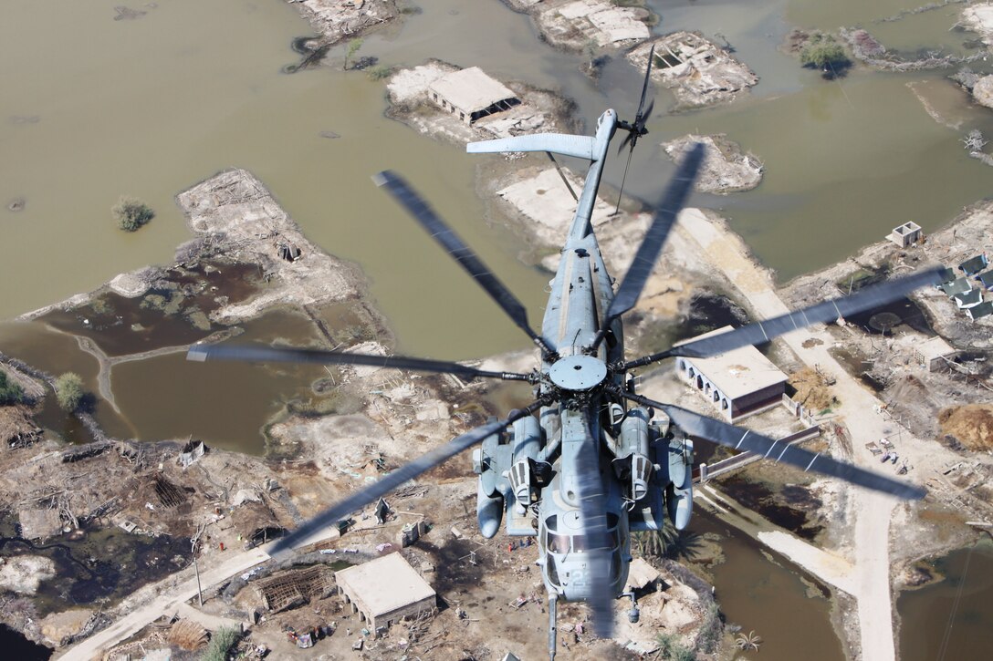 A Marine Corps Super Stallion helicopter from VMM-266 (REIN), 26th Marine Expeditionary Unit, flies in route to deliver relief supplies during humanitarian assistance operations in the southern province of Sindh, Pakistan.