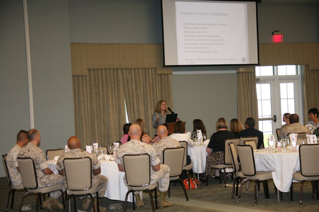 A group of Cherry Point’s Marines, Sailors and civilian employees listen to Dr. Rebecca J. Macy speak about domestic violence in the Marine Corps at the 2010 Domestic Violence Awareness Month Commanders/Leadership and Partners Breakfast at Miller’s Landing Oct. 1. Macy talked about the effects domestic violence has on children and ways to help deal with domestic violence. Macy is an associate professor at the University of North Carolina, Chapel Hill’s School of Social Work.