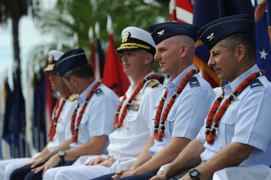 The official party of the Full Operational Capability Commemoration Ceremony observe the proceedings during the Oct. 1 ceremony at the Missing Man Formation Memorial at Aloha Aina Park. The FOC ceremony marks the joining of two historic military installations, Naval Station Pearl Harbor and Hickam Air Force Base. (U.S. Air Force photo by Staff Sgt. Nathan Allen)