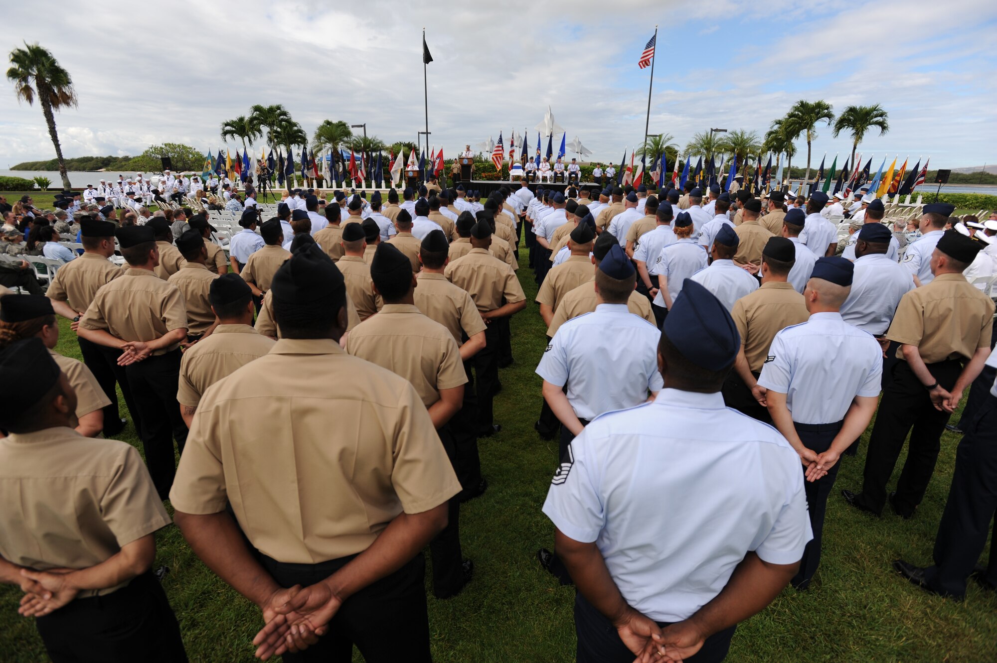 Rear Adm. Dixon Smith, Navy Region Hawaii commander, addresses the attendees of the Full Operational Capability Commemoration Ceremony Oct. 1 at the Missing Man Formation Memorial at Aloha Aina Park. The FOC ceremony marks the joining of two historic military installations, Naval Station Pearl Harbor and Hickam Air Force Base. (U.S. Air Force photo by Staff Sgt. Nathan Allen)