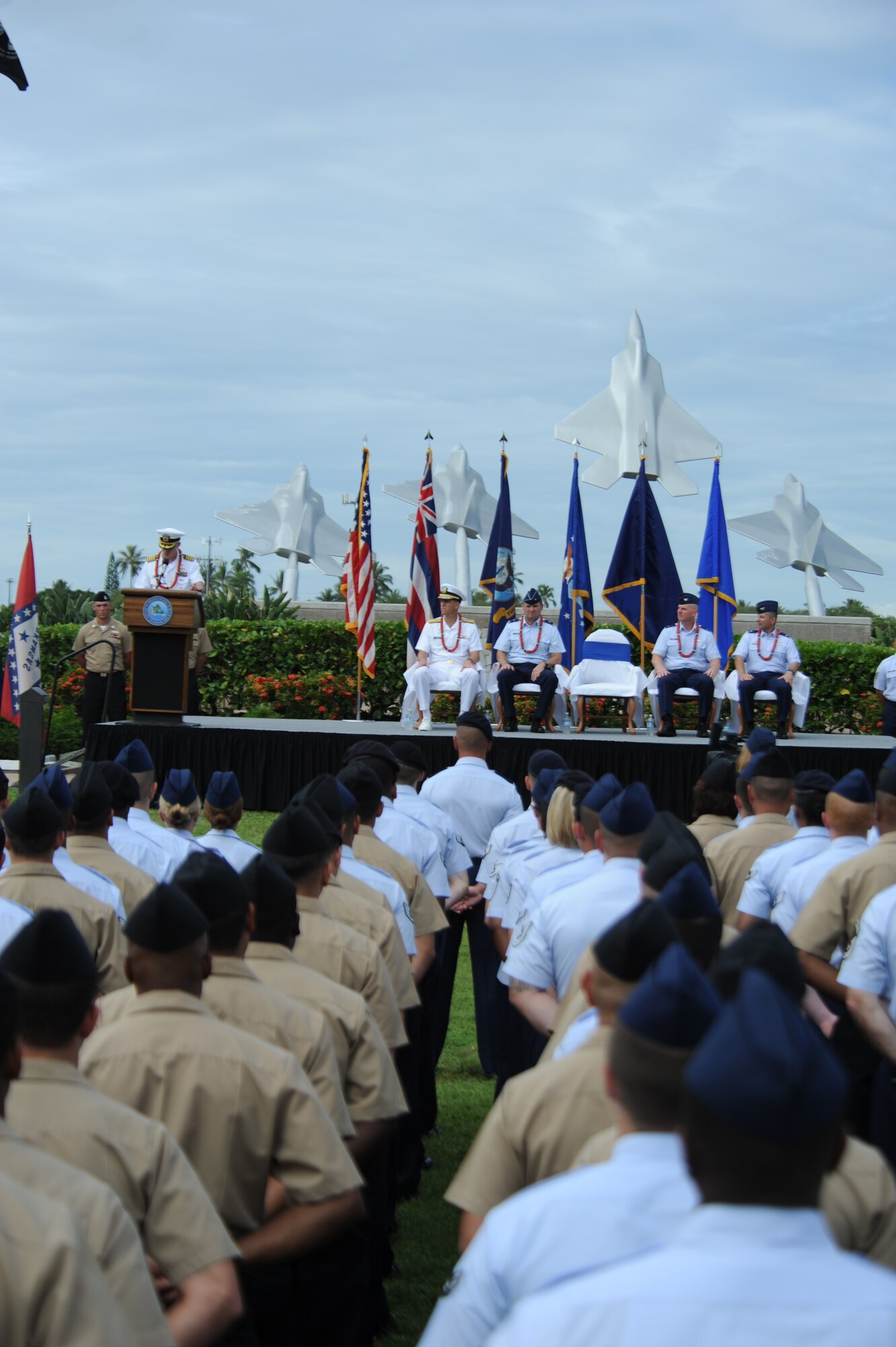Capt. Richard Kitchens, Joint Base Pearl Harbor-Hickam commander, addresses the attendees of the Full Operational Capability Commemoration Ceremony Oct. 1 at the Missing Man Formation Memorial at Aloha Aina Park. The FOC ceremony marks the joining of two historic military installations, Naval Station Pearl Harbor and Hickam Air Force Base. (U.S. Air Force photo by Staff Sgt. Nathan Allen)