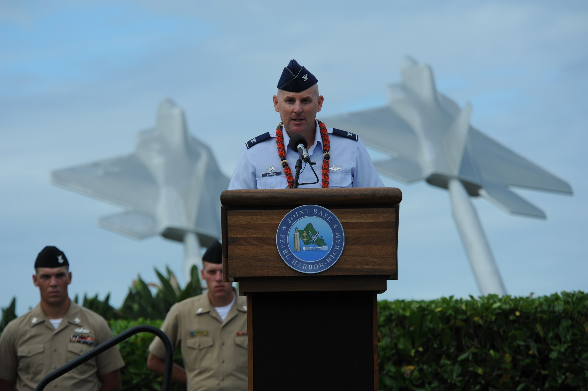 Col. Sam Barrett, 15th Wing commander, addresses the attendees of the Full Operational Capability Commemoration Ceremony Oct. 1 at the Missing Man Formation Memorial at Aloha Aina Park. The FOC ceremony marks the joining of two historic military installations, Naval Station Pearl Harbor and Hickam Air Force Base. (U.S. Air Force photo by Staff Sgt. Nathan Allen)