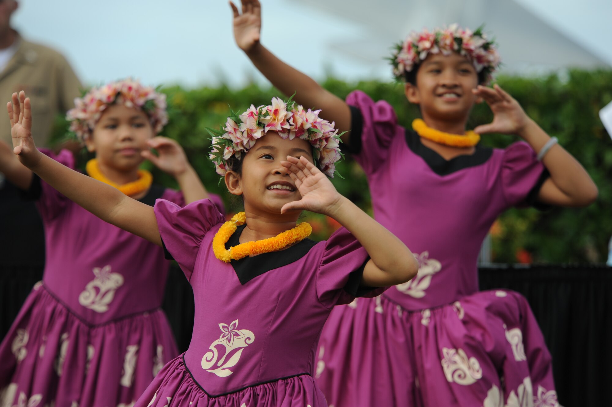 Keiki from Halau Hula Olana perform a traditional hula dance as part of the introductory celebrations of the Full Operational Capability Commemoration Ceremony  Oct. 1 at the Missing Man Formation Memorial at Aloha Aina Park. The FOC ceremony marks the joining of two historic military installations, Naval Station Pearl Harbor and Hickam Air Force Base. (U.S. Air Force photo by Staff Sgt. Nathan Allen)
