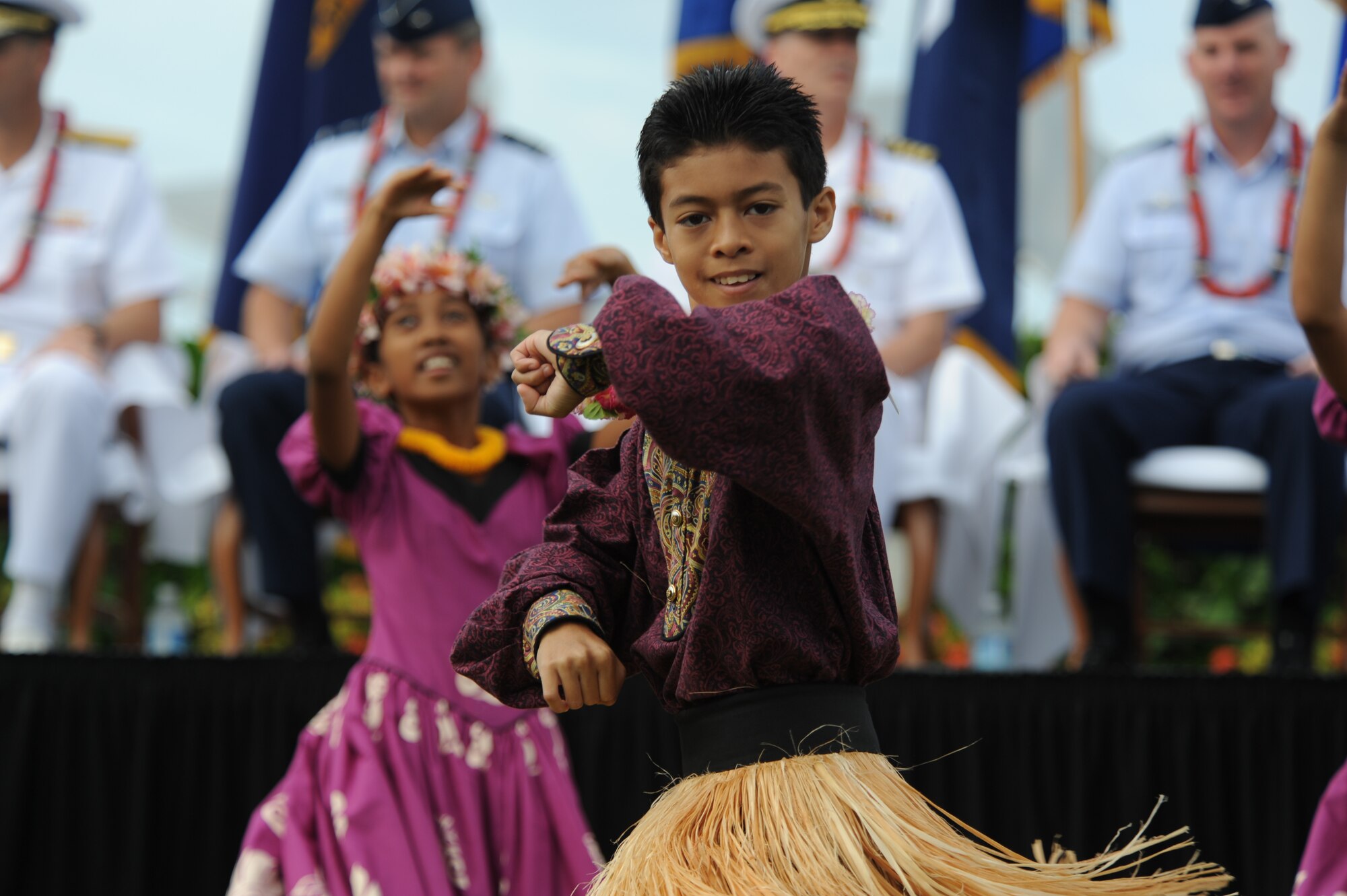 Keiki from Halau Hula Olana perform a traditional hula dance as part of the introductory celebrations of the Full Operational Capability Commemoration Ceremony  Oct. 1 at the Missing Man Formation Memorial at Aloha Aina Park. The FOC ceremony marks the joining of two historic military installations, Naval Station Pearl Harbor and Hickam Air Force Base. (U.S. Air Force photo by Staff Sgt. Nathan Allen)