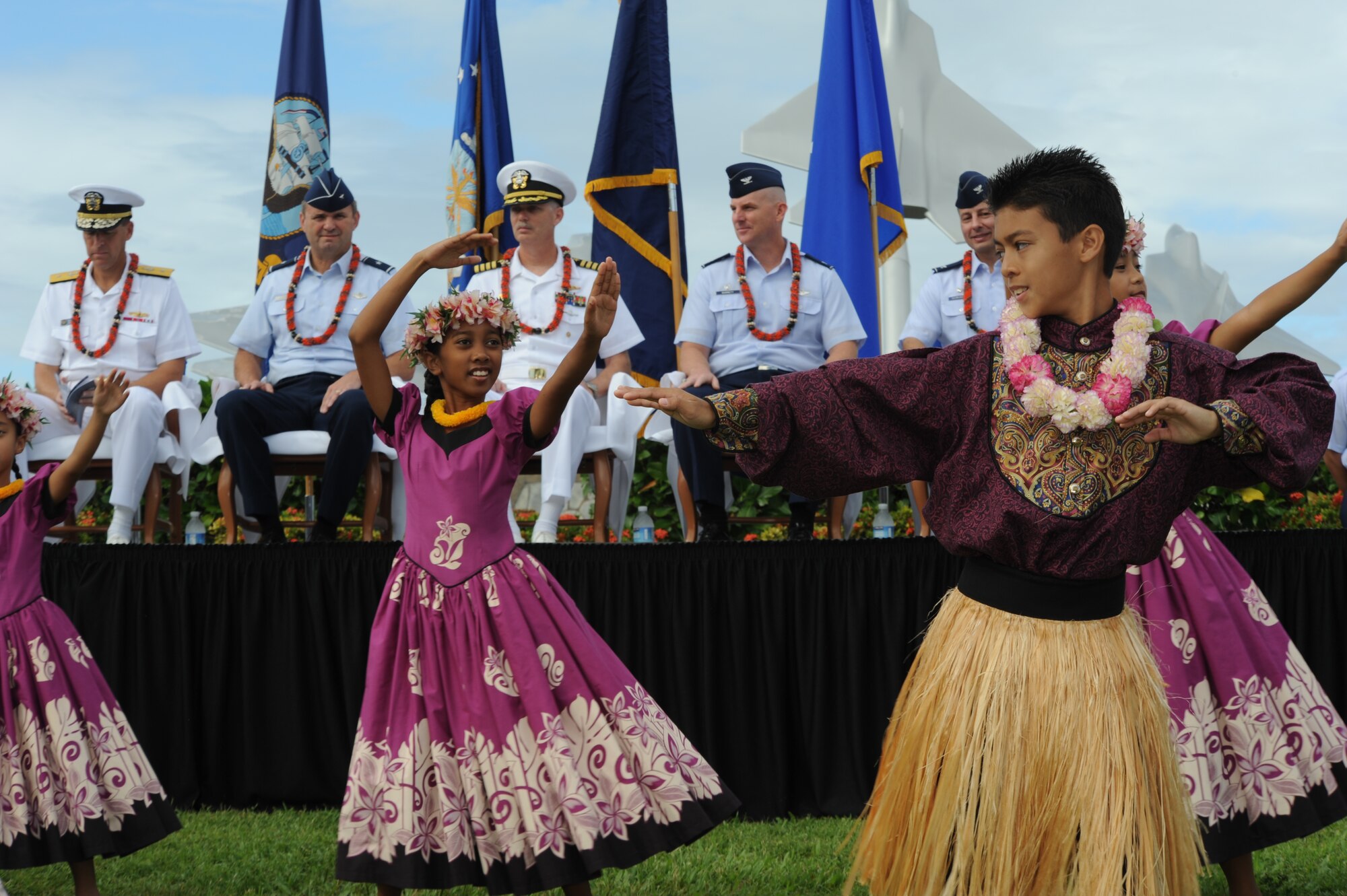 Keiki from Halau Hula Olana perform a traditional hula dance as part of the introductory celebrations of the Full Operational Capability Commemoration Ceremony  Oct. 1 at the Missing Man Formation Memorial at Aloha Aina Park. The FOC ceremony marks the joining of two historic military installations, Naval Station Pearl Harbor and Hickam Air Force Base. (U.S. Air Force photo by Staff Sgt. Nathan Allen)