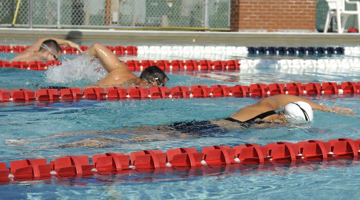 Navy Lt. j.g. Cassandra Mitchell races to the finish line during the two-man relay swim challenge held during the weeklong Commander?s Cup that led up to the full operational capability inauguration of Joint Base Charleston, S.C., Oct. 1, 2010. Lieutenant Mitchell is with the Naval Nuclear Power Training Center on Joint Base Charleston - Weapons Station. (U.S. Navy photo/Mass Communication Specialist 1st Class Jennifer R. Hudson/released)
