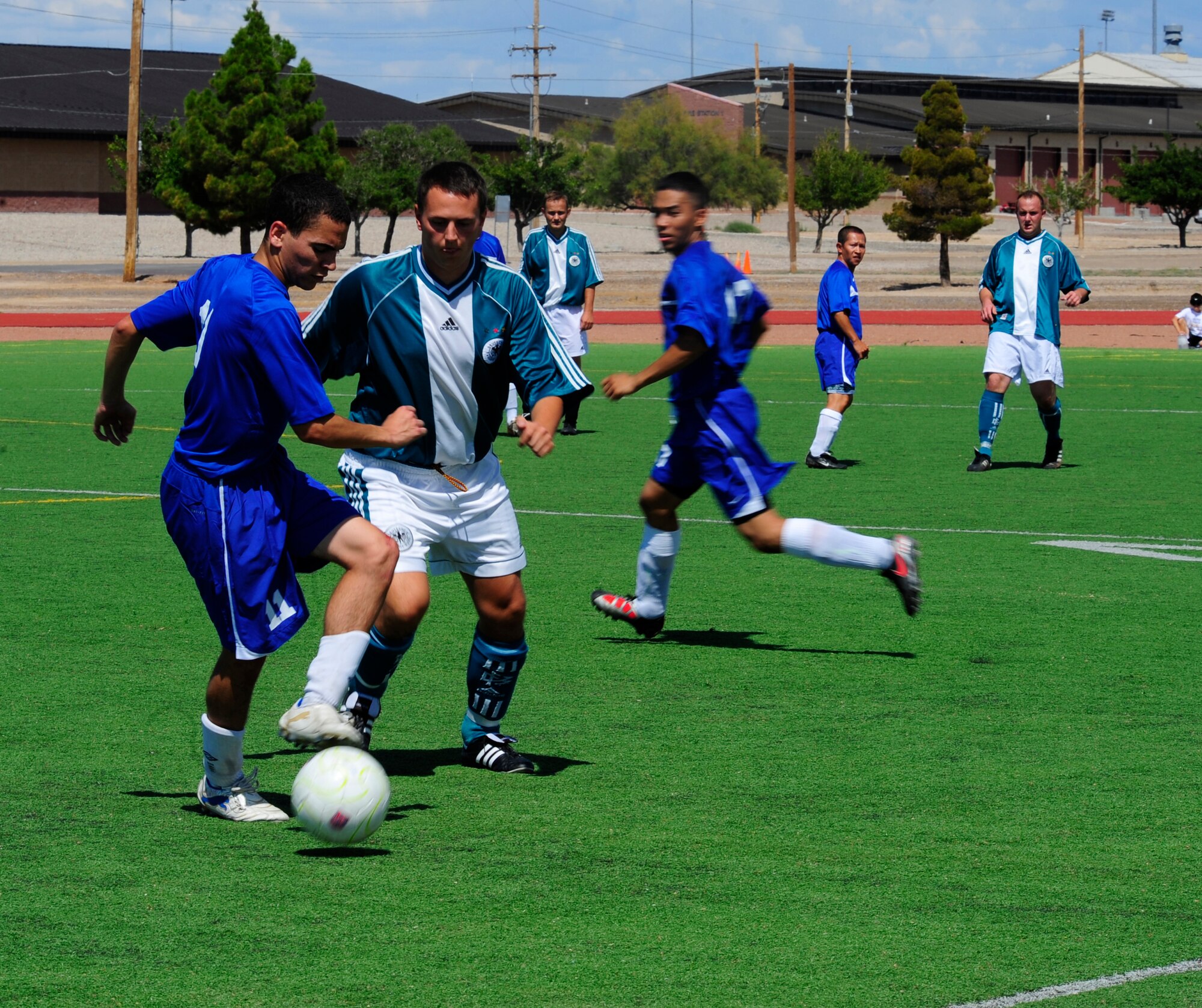 HOLLOMAN AIR FORCE BASE, N.M. -- Members from the U.S. and German Air Forces compete against one another during the Oktoberfest International Soccer Match Sept. 25, 2010. Col. David Krumm, 49th Wing commander, issued the challenge to an international soccer match between the USAF and GAF as an opening event the Oktoberfest activities. The GAF won the game 3?1. (U.S. Air Force photo by Senior Airman Tiffany Trojca / Released)