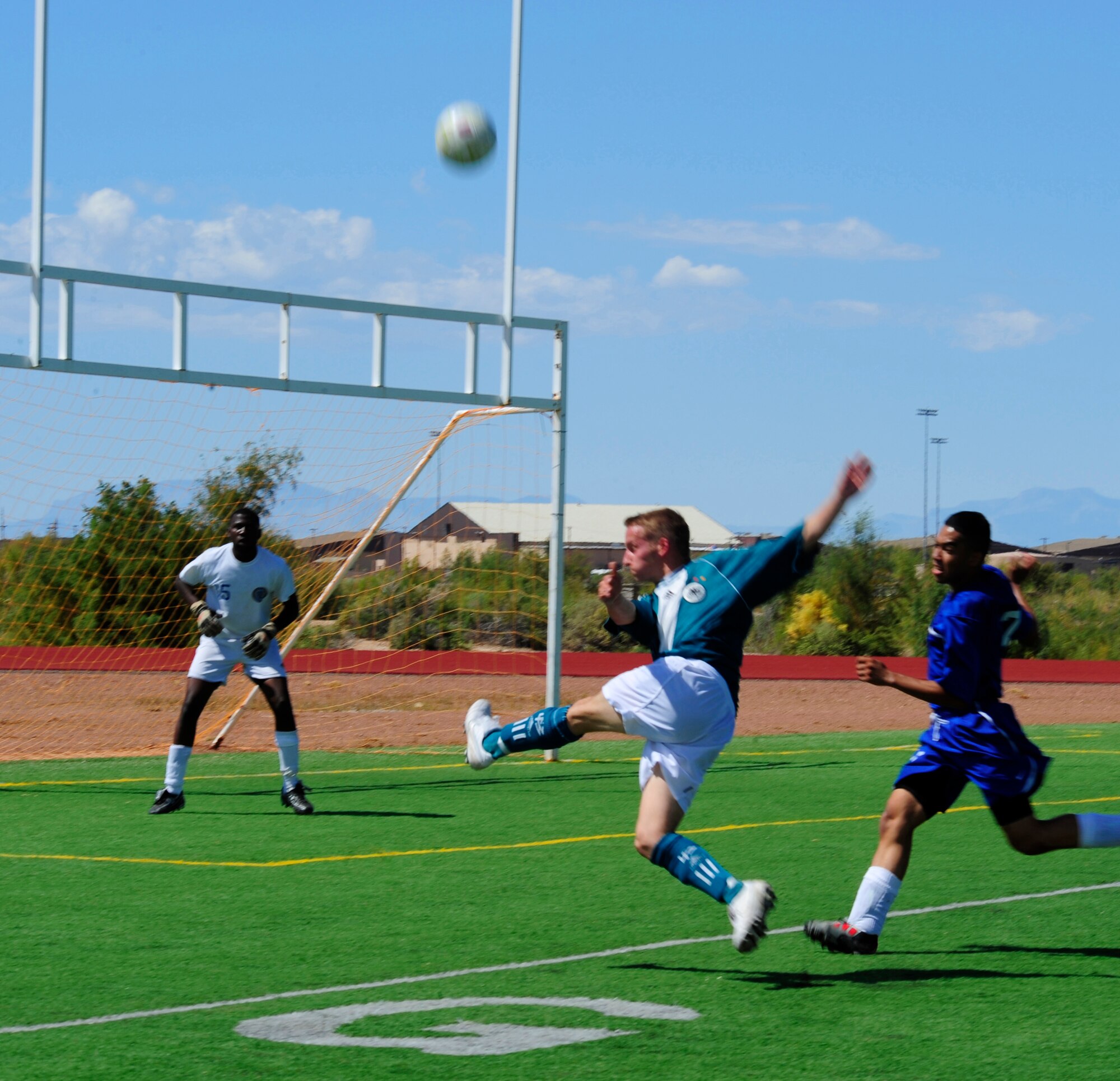 HOLLOMAN AIR FORCE BASE, N.M. -- A member of the German Air Force Flying Training Center makes a goal attempt during the Oktoberfest International Soccer Match against active-duty members of the U.S Air Force Sept. 25, 2010. The international soccer game between the U.S. Air Force and GAF was an opening event to the Oktoberfest activities that ensued later that evening. (U.S. Air Force photo by Senior Airman Tiffany Trojca / Released) 