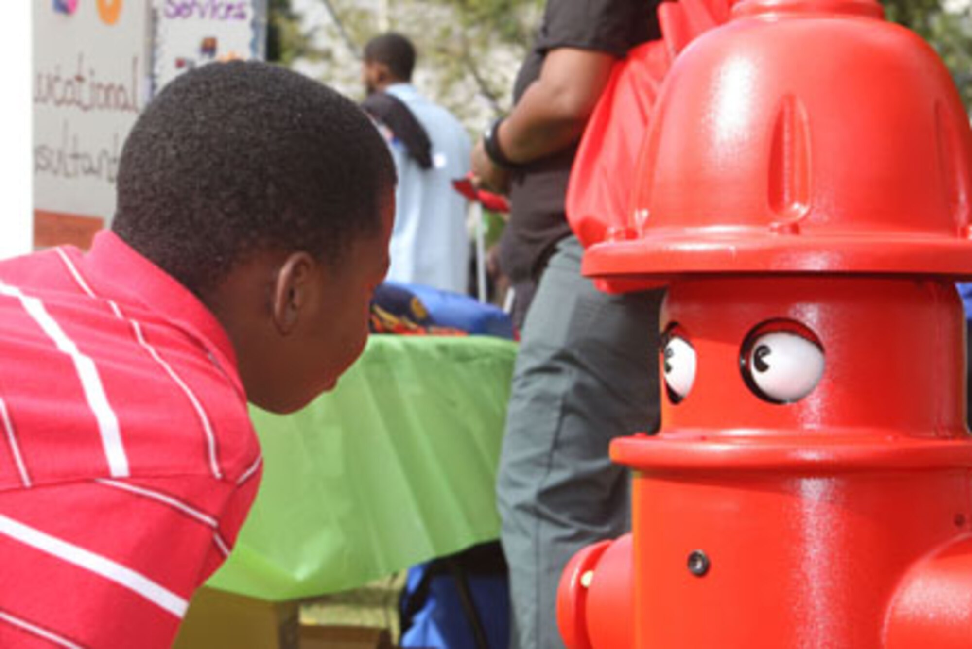 Dobbins Fire Department's interactive robot "Pluggy" was a hit as he made his way around Hurt Park in downtown Atlanta, GA. promoting fire safety awareness at the second annual Georgia State University Fire Safety Carnival 2010 held Sep. 30. (U.S. Air Force Photo/Don Peek)