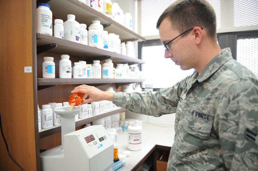 DYESS AIR FORCE BASE, Texas—Airman 1st Class Andrew Netz, 7th Medical Support Squadron pharmacy technician, counts pills at the pharmacy here, Sept. 21. Pharmacists work to ensure customers are given the proper prescribed medicine and in a timely matter. (U.S Air Force photo/ Airman 1st Class Shannon Hall)