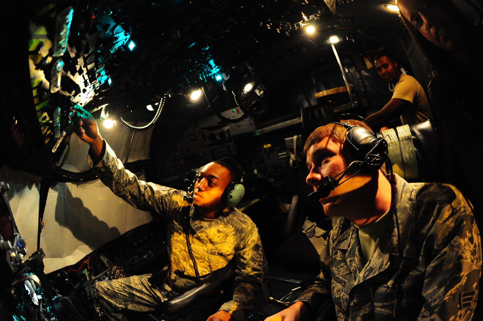 DYESS AIR FORCE BASE, Texas—Senior Airmen Billy Pryor (left) and David Ragsdale (right), 317th Maintenance Squadron fuel systems repair, refuel a C-130 Hercules here, Sept. 28. Both Airmen work through the night to make sure planes are adequately fueled for their next flight. This is mission essential due to the many hours planes spend in the air carrying troops, equipment and cargo to wherever needed. (U.S Air Force photo/ Airman 1st Class Shannon Hall)
