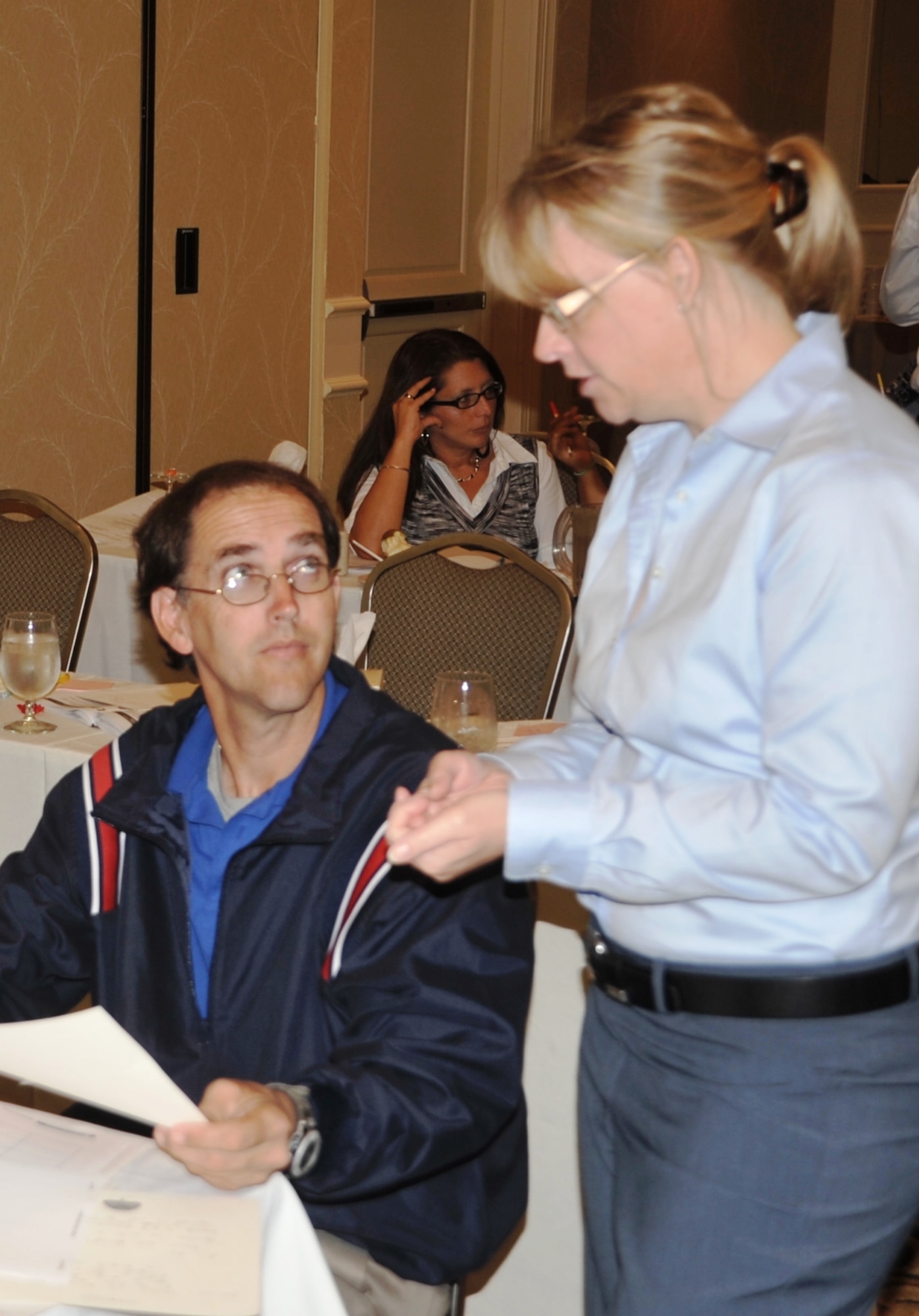 Ms. Susan Long (right), Air Mobility Command child and youth specialist, supports Mr. Steve Stutts of MacDill Air Force Base, Fla., during an advanced leadership training session for more than 30 youth coordinators from Air Mobility Command bases in O'Fallon, Ill., on Sept. 23, 2010. Each participant arrived to the Boys and Girls Club of America training with a project for their respective base's youth or teen center. During the training they learn how to advance their project into fruition. (U.S. Air Force Photo/Master Sgt. Scott T. Sturkol)