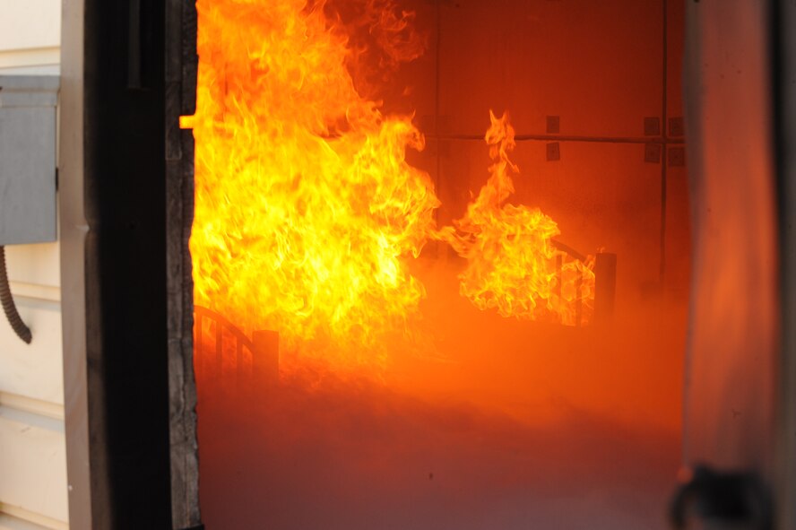 DYESS AIR FORCE BASE, Texas— A bed sits engulfed in flames during a training exercise held by the 7th Civil Engineer Squadron firefighters here, Sept. 30.  The squadron has more than 55 firefighters and operates more than 15 fire trucks. Some days the station gets up to ten calls and the firefighters are required to be on scene within five minutes of the call. They conduct routine safety checks on buildings as well as practice procedures in case of a fire.  (U.S Air Force photo/ Airman 1st Class Shannon Hall)