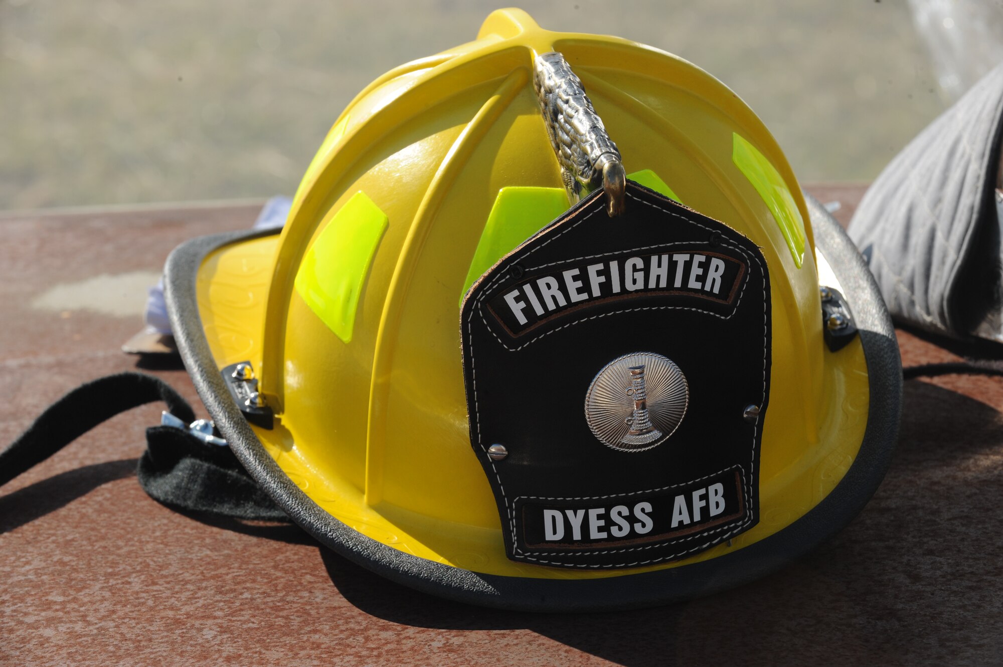 DYESS AIR FORCE BASE, Texas—A firefighter’s hat sits in the sun during a 7th Civil Engineer Squadron training exercise here, Sept. 30. The squadron has more than 55 firefighters and operates more than 15 fire trucks. Some days the station gets up to ten calls and the firefighters are required to be on scene within five minutes of the call. They conduct routine safety checks on buildings as well as practice procedures in case of a fire. (U.S Air Force photo/ Airman 1st Class Shannon Hall) 