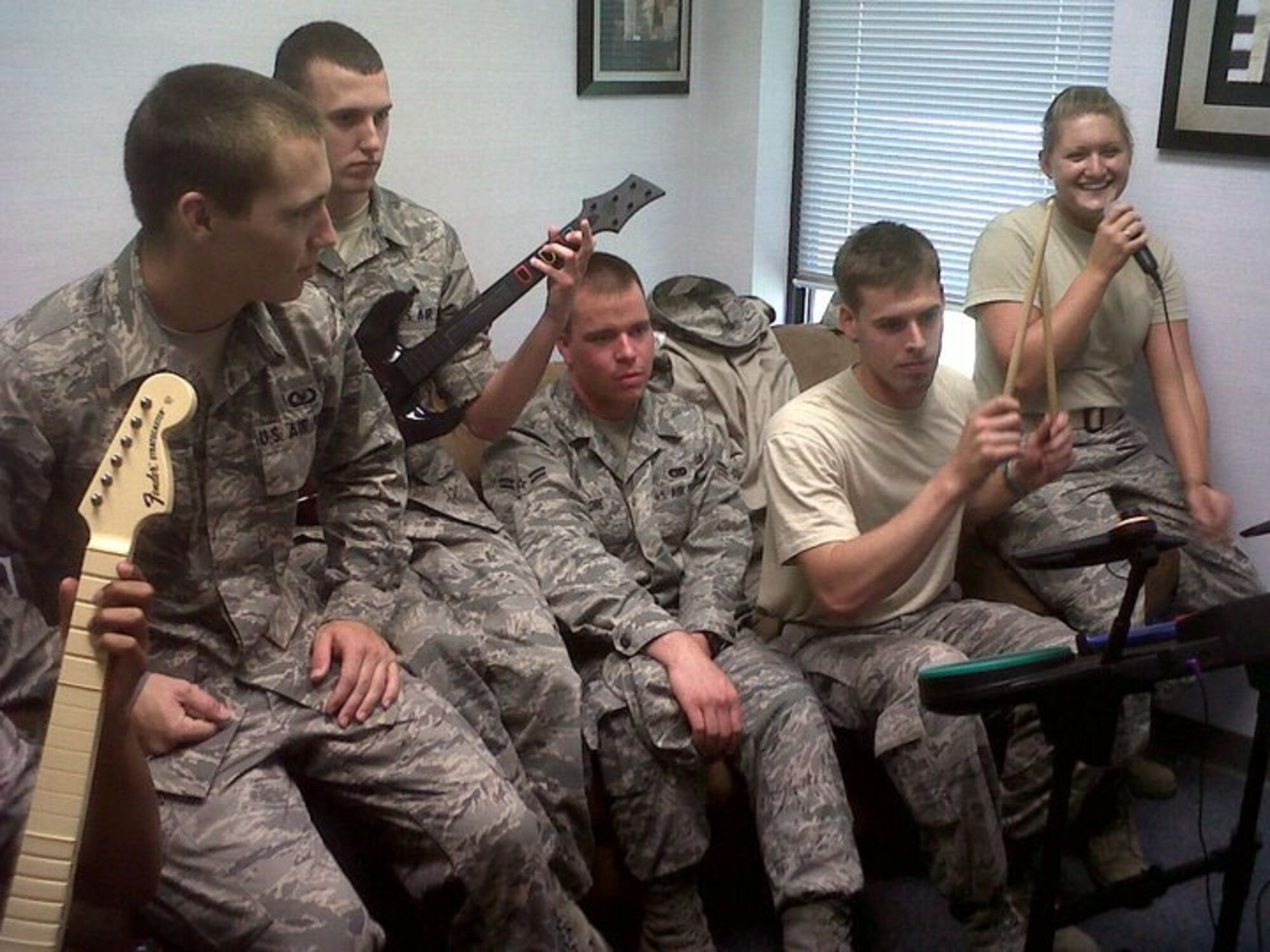 BARKSDALE AIR FORCE BASE, La. -- A group of Airmen play a video game at the River's Edge. The River's Edge offers a wide range of activities such as video game tournaments, a music room with various instruments, food and drinks, free wireless Internet and more. The River's Edge is held from 6-10 p.m. Tuesdays and Thursdays and from 6 p.m. to midnight on Fridays.  (Courtesy Photo)