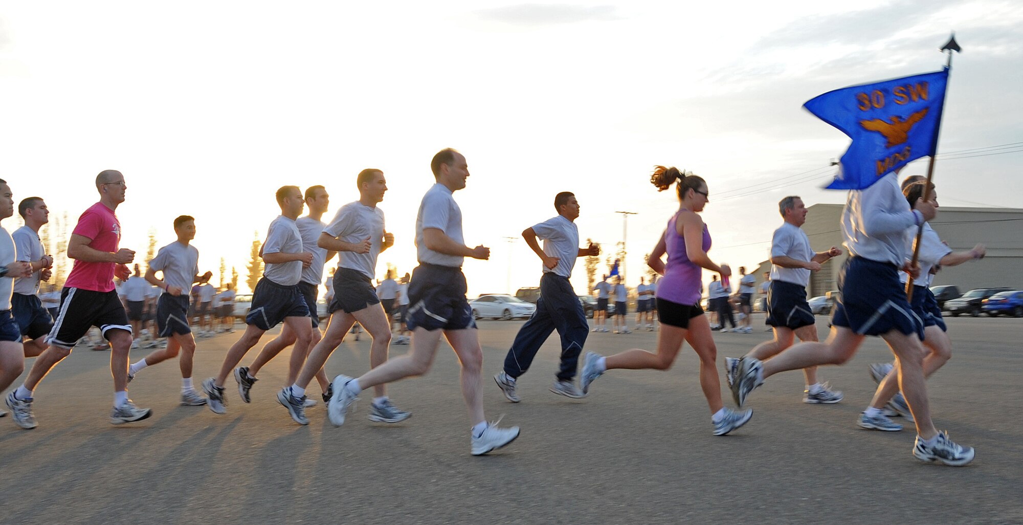 VANDENBERG AIR FORCE BASE, Calif. -- Starting strong, members of the 30th Medical Group take off during the Fit-to-Fight Run here Thursday, Sept. 30, 2010. This run was unique because participants were given the option to wear pink and purple shirts in support of Breast Cancer and Domestic Violence Awareness Month. (U.S. Air Force photo/ Senior Airman Ashley Reed)