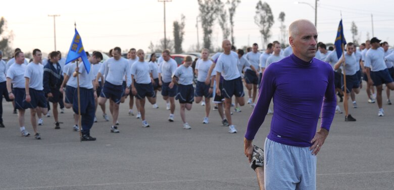 VANDENBERG AIR FORCE BASE, Calif. -- Col. Richard Boltz, the 30th Space Wing commander, wears a purple shirt during the Fit-to-Fight Run in support of domestic violence awareness here Thursday, Sept. 30, 2010. The base supports Domestic Violence Awareness Month with events, displays and educational opportunities throughout the month of October. (U.S. Air Force photo/Senior Airman Ashley Reed)