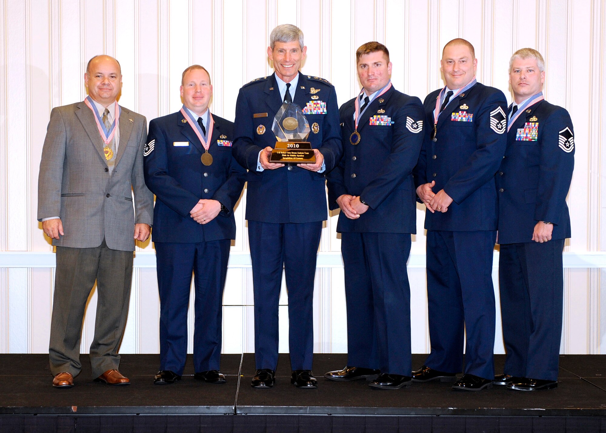 (From left to right) Mr. Eric Nolf, Tech. Sgt. Jason Conner, Air Force Chief of Staff Norton Schwartz, Tech. Sgt. Joshua Mursu, Senior Master Sgt. Robert Johnson and Master Sgt. James Pierce from teh 726th Air Mobility Squadron's C-17 Refuel Value Stream Analysis Team from Spangdahlem Air Base, Germany, receive their Air Force CSAF Team Excellence Award. (Courtesy photo) 