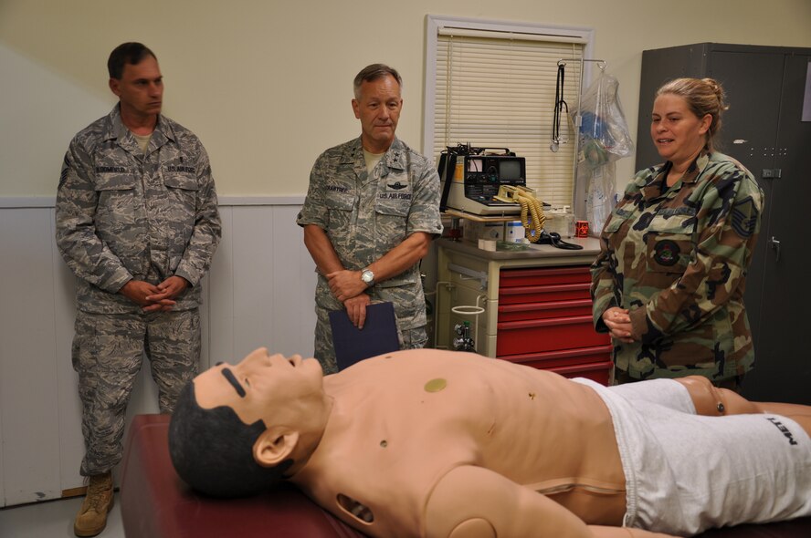 WRIGHT-PATTERSON AIR FORCE BASE, Ohio – Senior Master Sgt. David Bloomfield, 445th Aeromedical Staging Squadron, looks on as Master Sgt. Bethany Frazier, 445th Aeromedical Staging Squadron, gives Maj. Gen. Eric Crabtree, 4th Air Force commander, a tour of the Emergency Medical Technician School as part of his visit to the wing Sept. 28.  General Crabtree visited various areas of the wing during his two-day visit to the base. (U.S. Air Force photo/Staff Sgt. Robert Nelson)