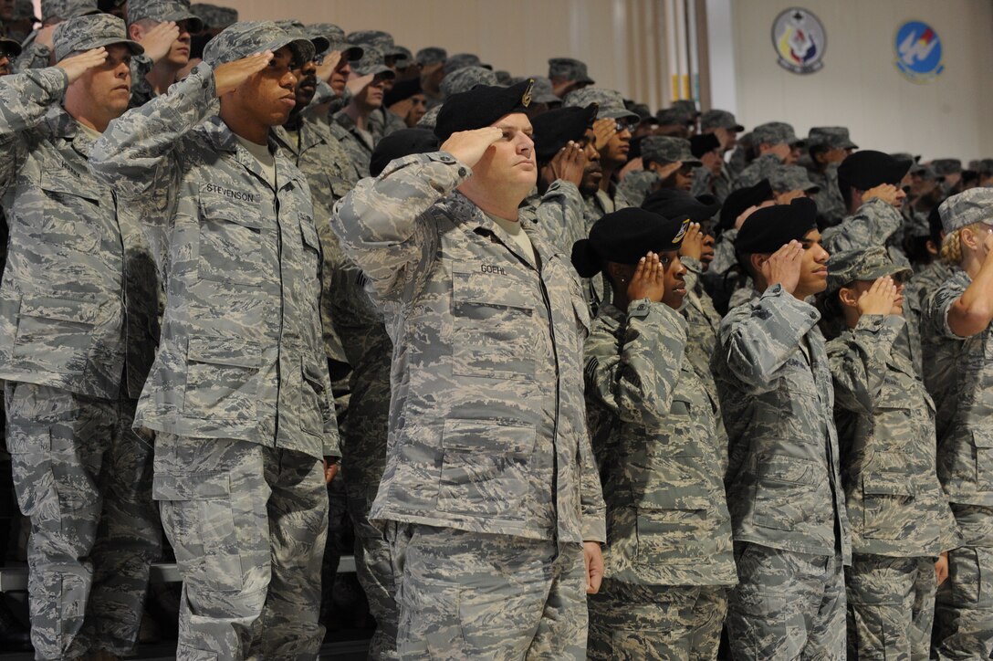 LANGLEY AIR FORCE BASE, Va - 633d Air Base Wing personnel render a salute during a ceremony declaring Full Operational Capability for Joint Base Langley-Eustis  Oct. 1.  After eight months of consolidations and transitions during the Initial Operational Capability period, JBLE has acgueved FOC status. (U.S. Air Force Photo/Staff Sgt. Tabitha Kuykendall)(RELEASED)  