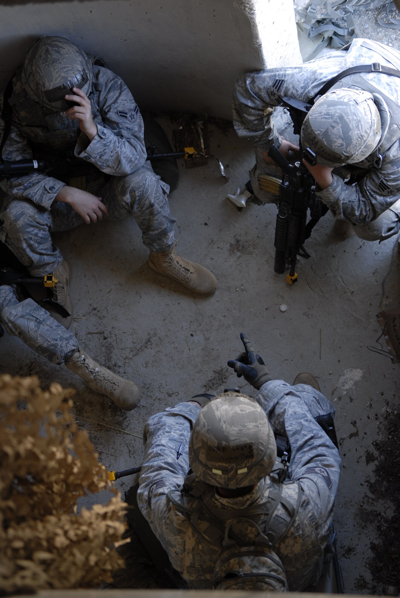 VANDENBERG AIR FORCE BASE, Calif. – Thirtieth Security Forces Squadron members protect themselves during a simulated mortar attack during the Northstar exercise here Thursday, Sept. 23, 2010.  Airmen who participated had the chance to feel what it is like during a deployed environment.  (U.S. Air Force photo/Senior Airman Andrew Satran) 

 

 

 
 

 
