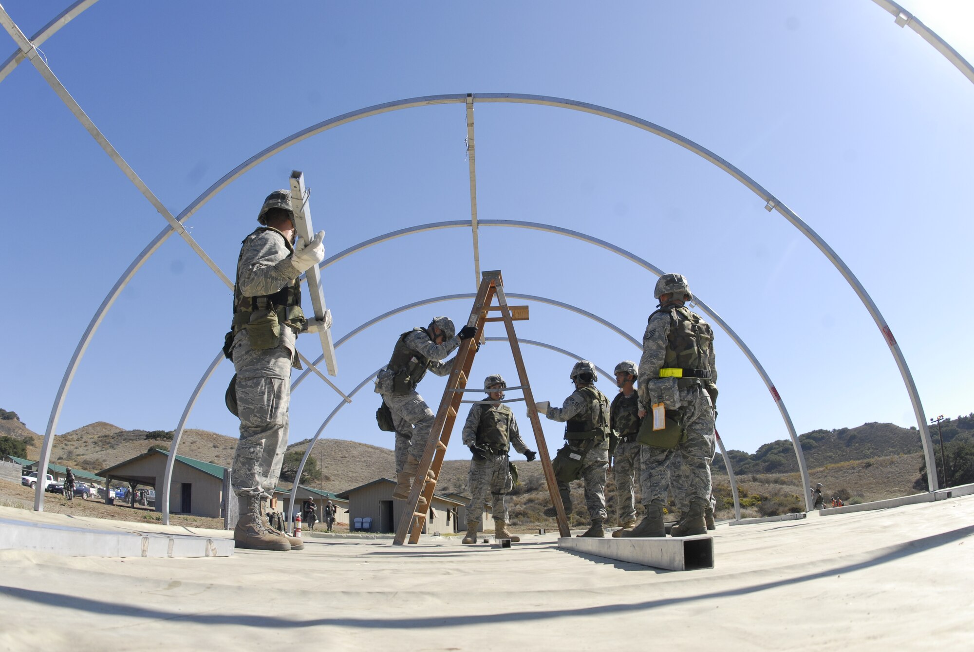 VANDENBERG AIR FORCE BASE, Calif. -- Airmen with the 30th Medical Group set up a tent to assist simulated wounded members in the Northstar exercise here Thursday, Sept. 23, 2010.  The exercise helps Airmen use their professional skills to ensure success during the deployed exercise. (U.S. Air Force photo/Senior Airman Andrew Satran) 

 

 