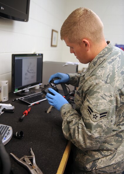 DYESS AIR FORCE BASE, Texas-- Airman 1st Class Matthew Daniels, 7th Operations Support Squadron aircrew flight equipment journeyman, assembles life support equipment Sept. 28 here. Inspections are performed to ensure there are no holes or cracks in the equipment and it is serviceable. (U.S. Air Force photo/ Senior Airman Felicia Juenke)