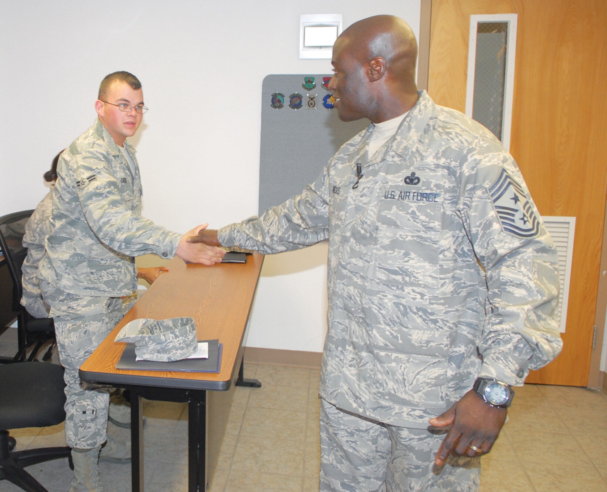 Chief Master Sgt. Rory Wicks, 56th Fighter Wing command chief, meets Airman 1st Class Kyle Green, 56th Operations Support Squadron, during his first visit to the First Term Airmen Center since assuming the position as the senior enlisted member on base.  (U.S. Air Force photo/Senior Master Sgt. Larry Schneck)