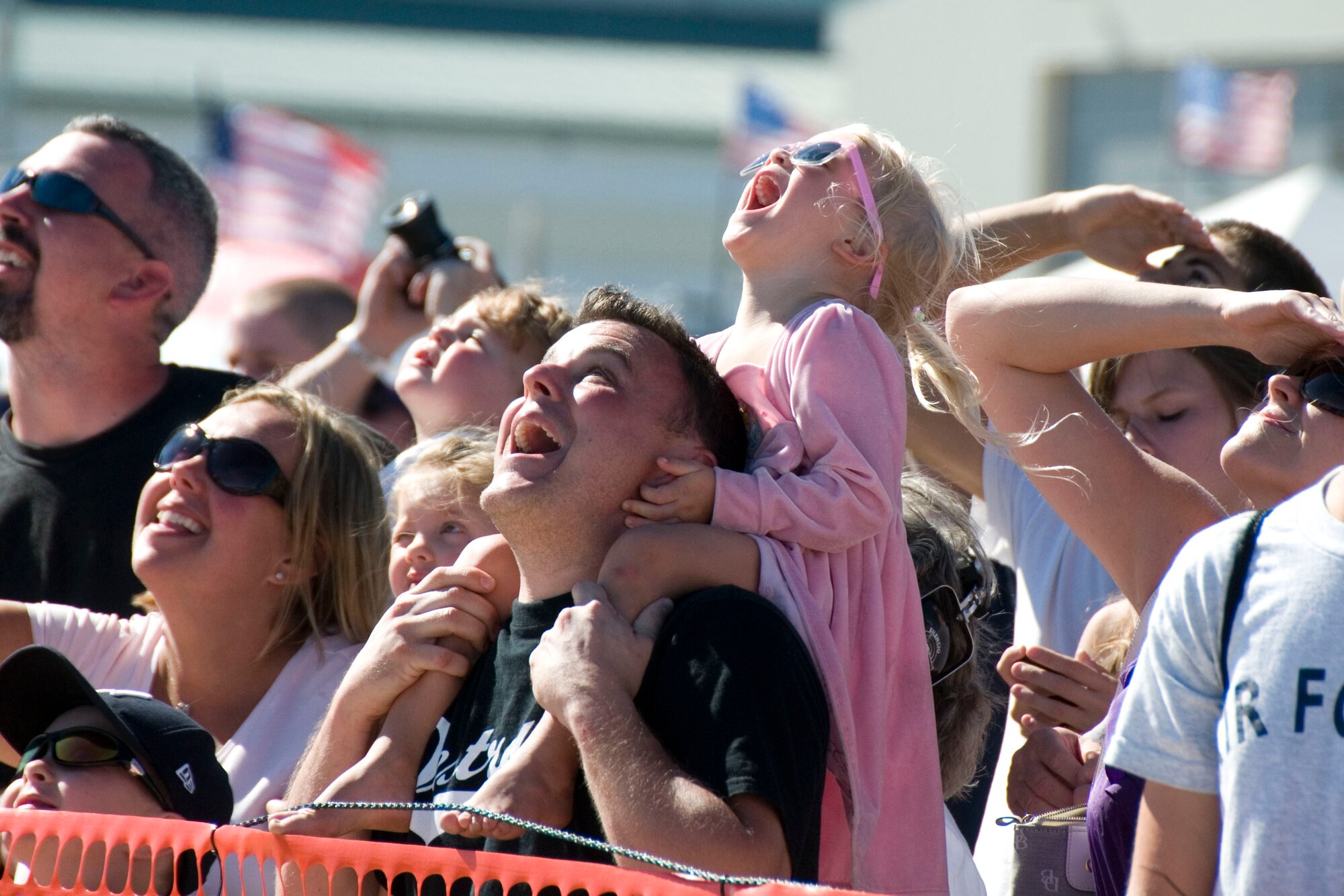 Spectators marvel at the aerial manuevers of the U.S. Air Force Thunderbirds during the Thunder Over the Blue Ridge Air Show. The 167th Airlift Wing, West Virginia Air National Guard unit in Martinsburg, WV held an open house in conjunction with the Thunder Over the Blue Ridge Air Show on September 4 and 5, 2010. The U.S. Air Force Thunderbirds and the U.S. Army Golden Knights headlined the show. (U.S. Air Force photo by MSgt Emily Beightol-Deyerle)