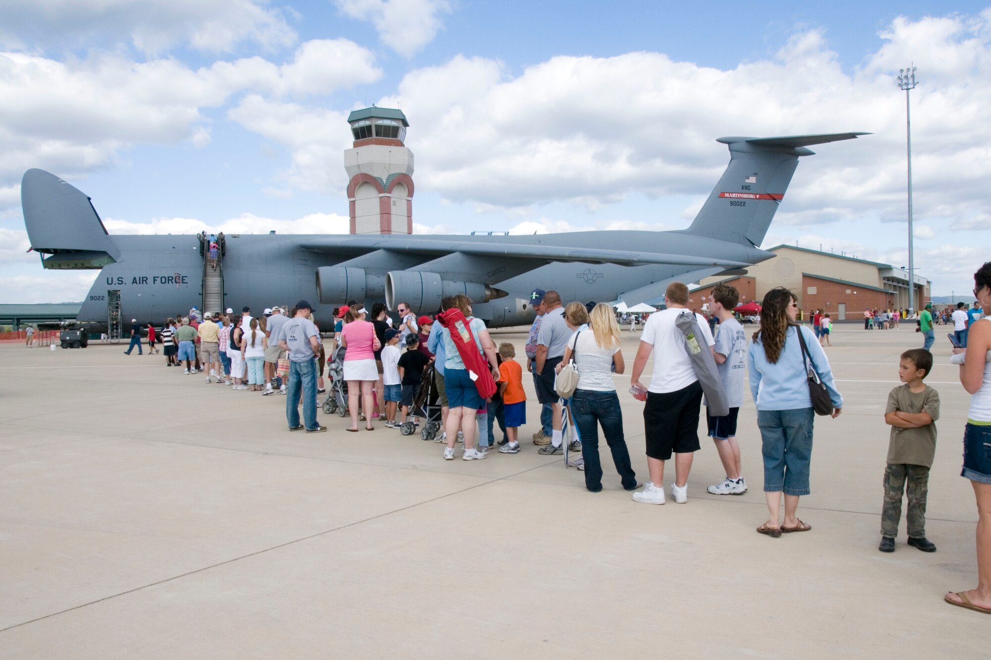 Air show spectators line up to get a look inside the C-5 Galaxy aircraft on display at the 167th Airlift Wings Open House. The 167th Airlift Wing, West Virginia Air National Guard unit in Martinsburg, WV held an open house in conjuction with the Thunder Over the Blue Ridge Air Show on September 4 and 5, 2010. The U.S. Air Force Thunderbirds and the U.S. Army Golden Knights headlined the show. (U.S. Air Force photo by MSgt Emily Beightol-Deyerle)