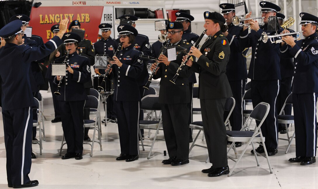 LANGLEY AIR FORCE BASE, Va - The Joint Base Langley-Eustis band plays the national anthem during a ceremony declaring Full Operational Capability for Joint Base Langley-Eustis at Langley Oct. 1.  The purpose of joint basing is to reconfigure Department of Defense infrastructure into one where operational capacity is optimized for warfighting capability and efficiency. (U.S. Air Force Photo/Staff Sgt. Tabitha Kuykendall) (RELEASED)  