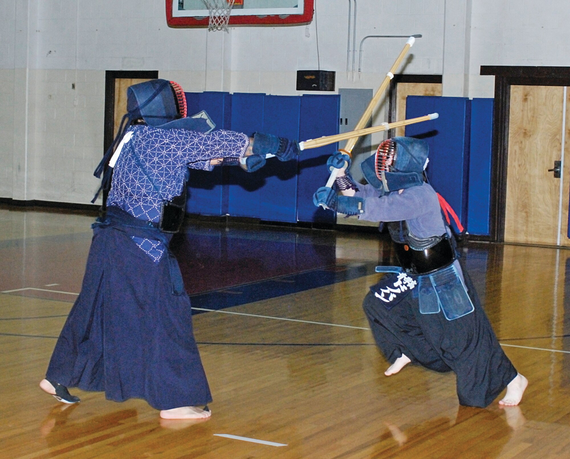 Will Antonio, left, and Donovan Heimer practice Kendo at the East Fitness Center. Courtesy Photo by Perry Heimer.