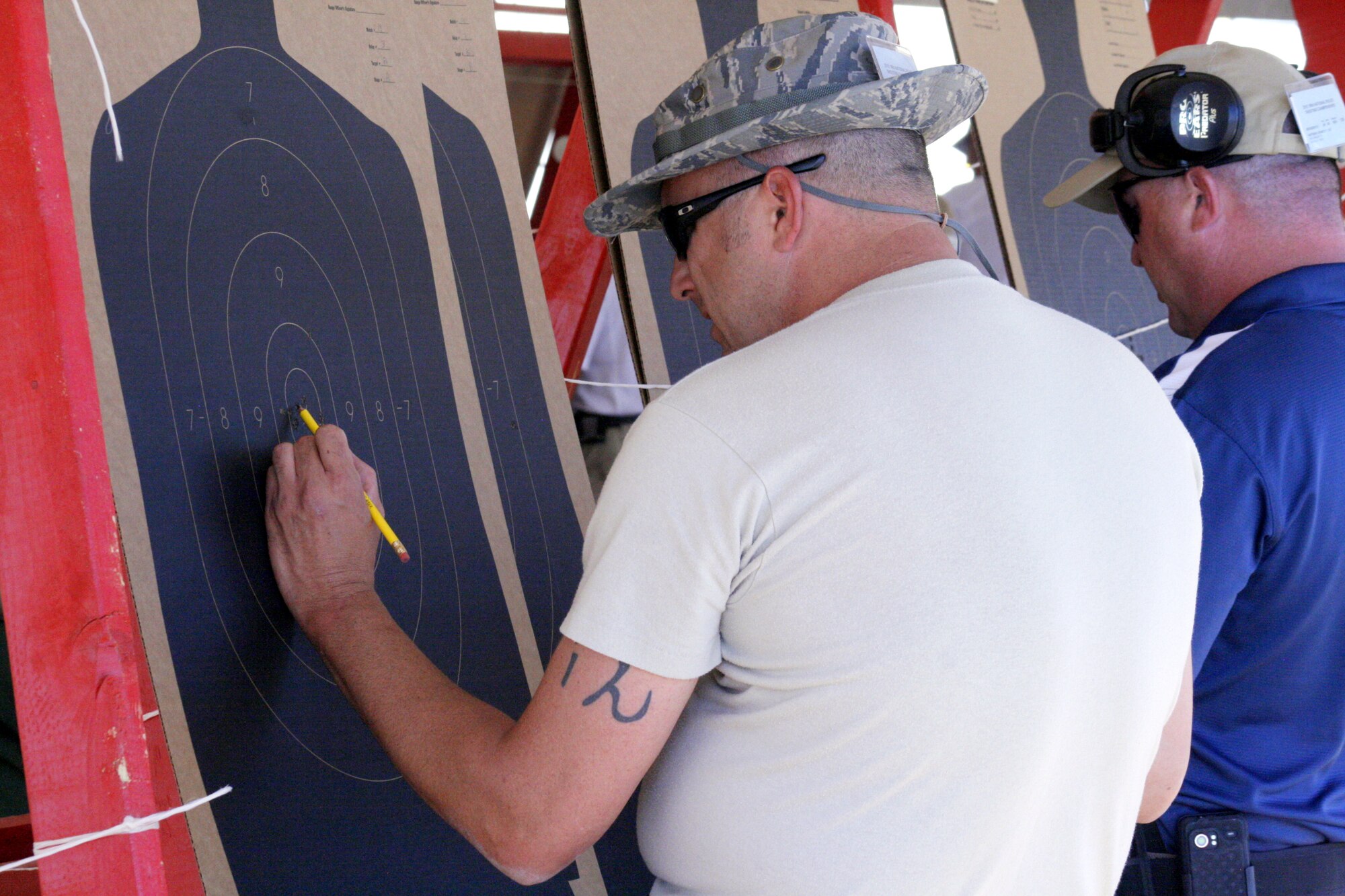 Master Sgt. Mark Long, assigned to the 377th Security Forces Squadron at Kirtland AFB, N.M., scores a target Sept. 21 at the National Police Shooting Championship in Albuquerque.   Photo courtesy of NRAblog.com 