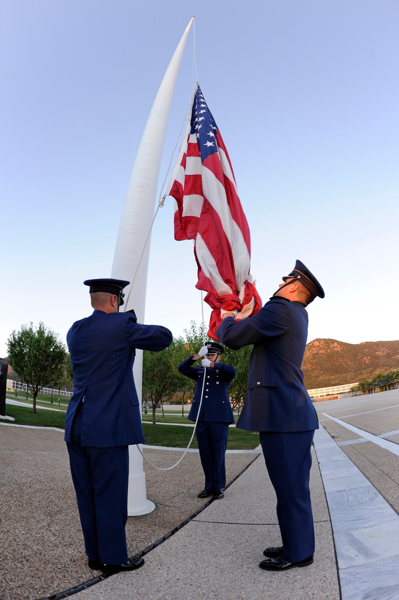 A cadet honor guard prepares to raise an American flag at the Air Force Academy during a reveille ceremony in memory of Cadet 1st Class Marc Henning Sept. 28, 2010. The Academy and Cadet Henning's family held a memorial service at the Cadet Chapel the same day. (U.S. Air Force photo/Mike Kaplan)