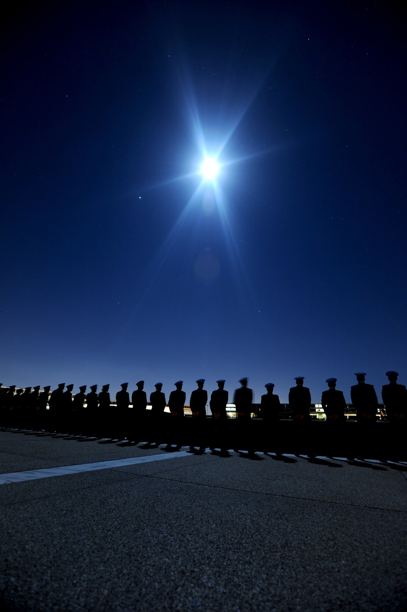 Cadets honor Cadet 1st Class Marc Henning during a Taps ceremony in the Terrazzo Sept. 21. Cadet Henning, 22, was a native of Crossville, Ill. He died Sept. 17. (U.S. Air Force photo/Johnny Wilson)