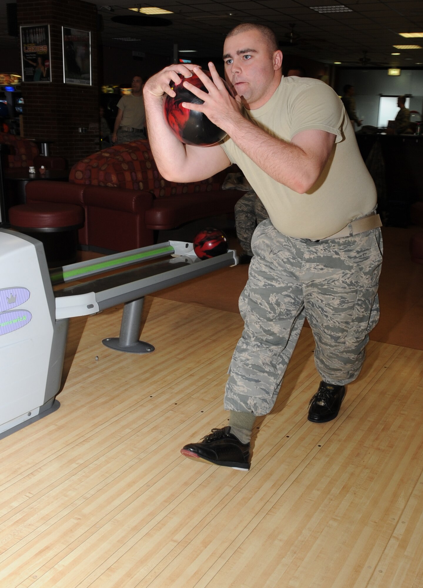 SPANGDAHLEM AIR BASE, Germany – Airman 1st Class Brett Dickinson, 606th Air Control Squadron surveillance technician, bowls during a Combined Federal Campaign “kick-off” fundraiser Sept. 30. A bowl-a-thon was held for CFC to raised money for charitable organizations on the base. (U.S. Air Force photo/Senior Airman Nick Wilson)