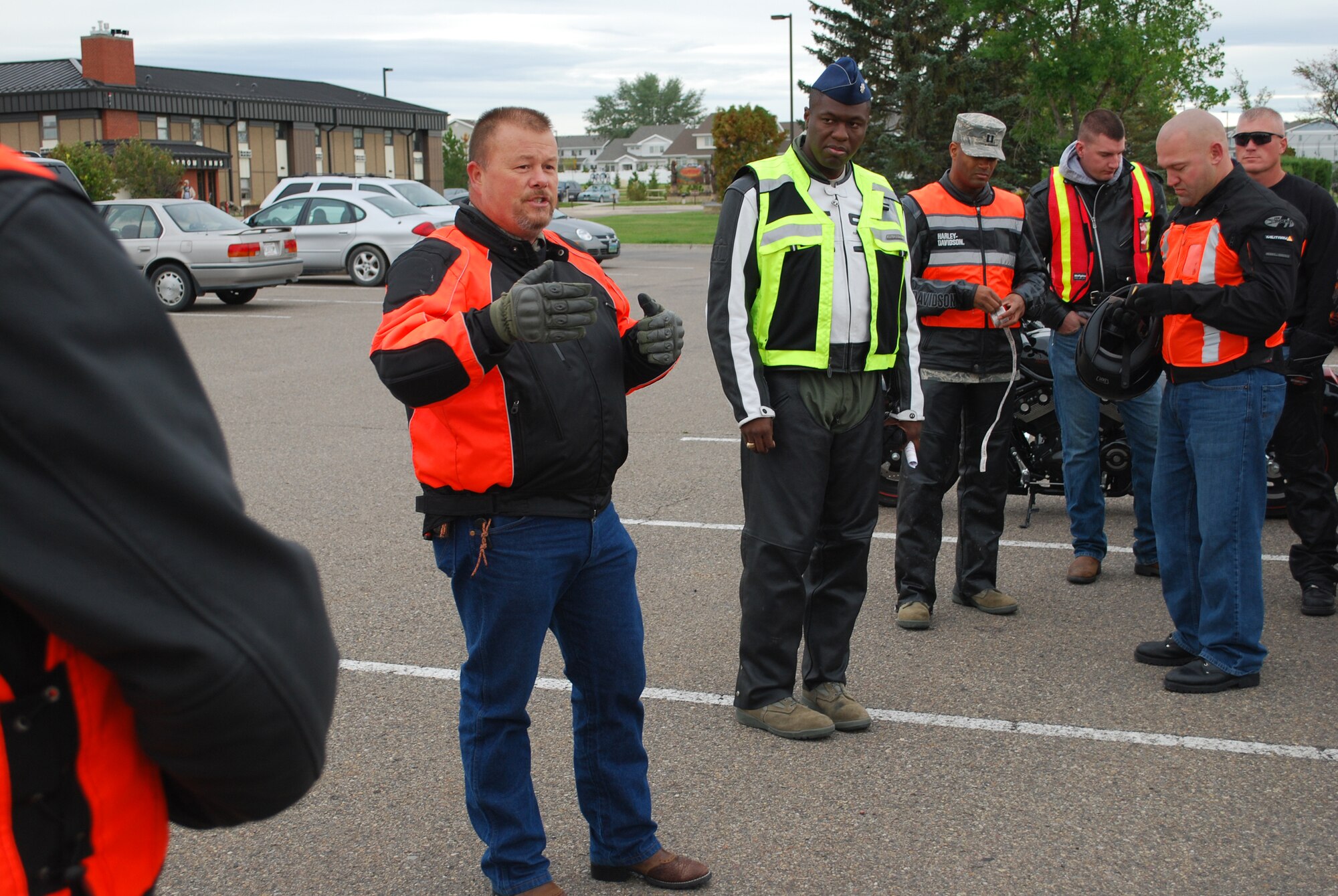 Kelly Nathe, 341st Missile Wing Traffic Safety Manager, provides a safety briefing to motorcycle riders participating in the "End of Year Motorcycle Ride" Sept. 24. Riders started at the club parking lot on a ride that took them through the Highwood to Fort Benton, Mont., before returning to bsae. (U.S. Air Force photo/Airman 1st Class Kristina Overton)