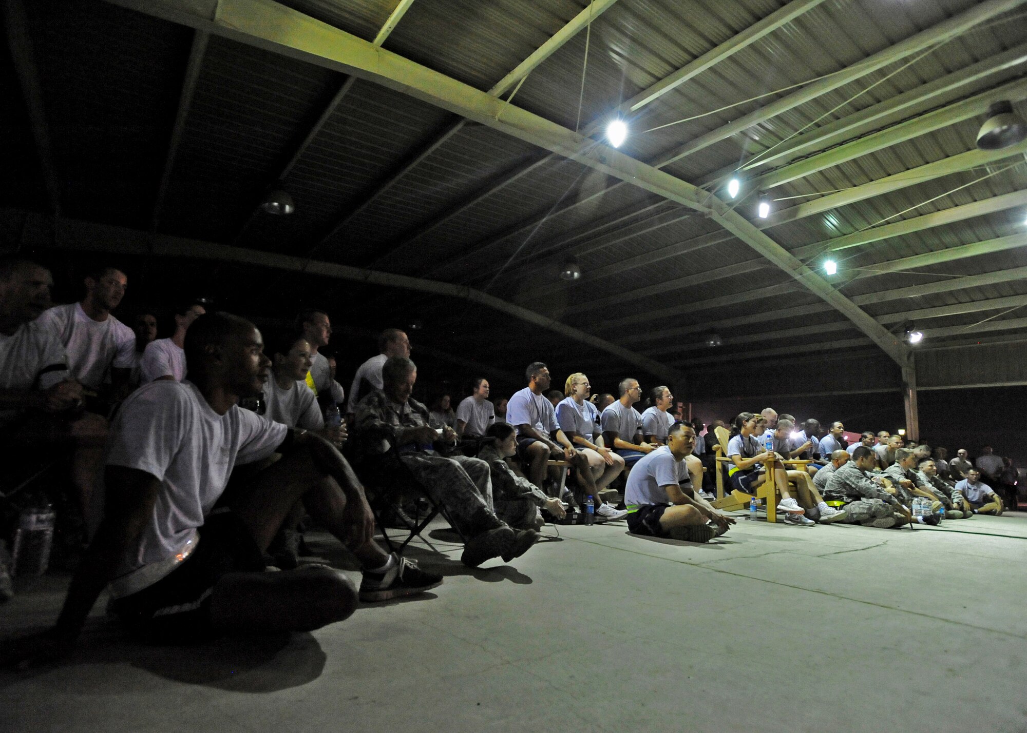SOUTHWEST ASIA - Members of the U.S. Armed Forces listen as Aaron Lewis, lead vocalist and rhythm guitarist for the rock group Staind, performs for the troops during a United Service Organizations tour at an undisclosed air base in Southwest Asia on Sep. 28, 2010. USO is a private, nonprofit organization that provides morale and recreational services to members of the U.S. military, with programs in 140 centers worldwide. (U.S. Air Force photo by Senior Airman Laura Turner) 