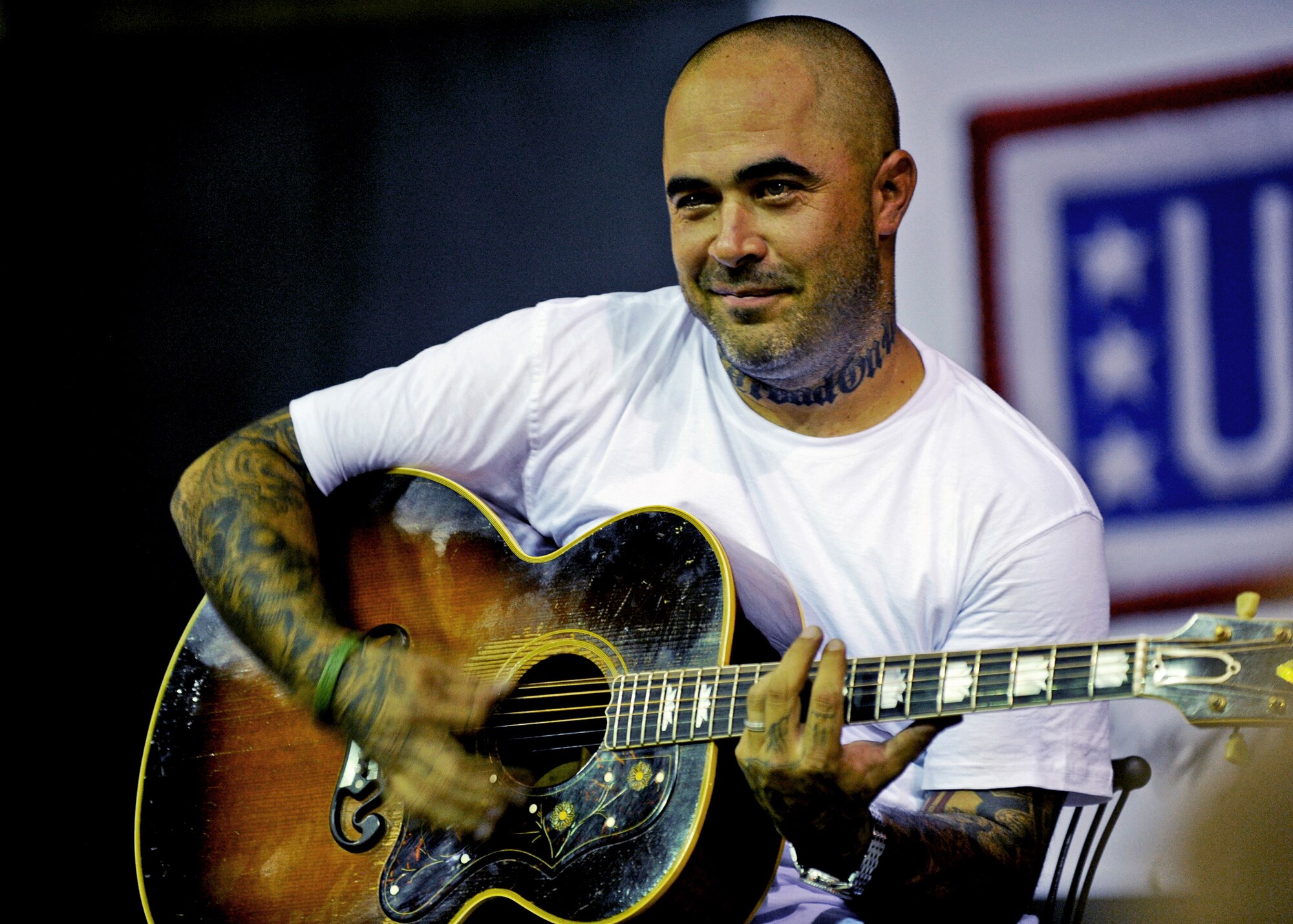 SOUTHWEST ASIA - Aaron Lewis, lead vocalist and rhythm guitarist for the rock group Staind, performs for U.S. troops during a United Service Organizations tour at an undisclosed base in Southwest Asia on Sep. 28, 2010. USO is a private, nonprofit organization that provides morale and recreational services to members of the U.S. military, with programs in 140 centers worldwide. (U.S. Air Force photo by Senior Airman Laura Turner)
