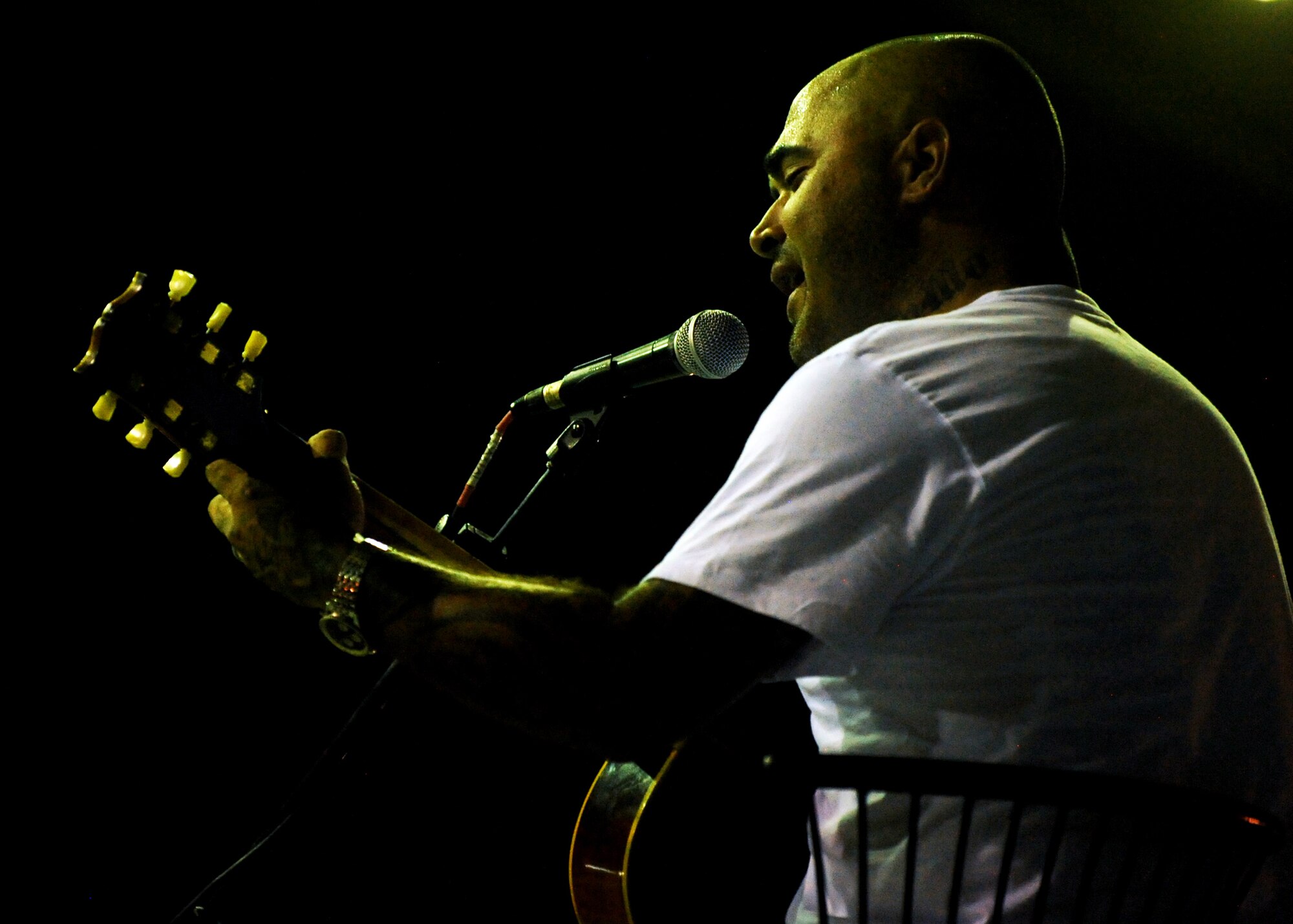 SOUTHWEST ASIA - Aaron Lewis, lead vocalist and rhythm guitarist for the rock group Staind, performs for U.S. troops during a United Service Organizations tour at an undisclosed air base in Southwest Asia on Sep. 28, 2010. USO is a private, nonprofit organization that provides morale and recreational services to members of the U.S. military. (U.S. Air Force photo by Senior Airman Laura Turner)