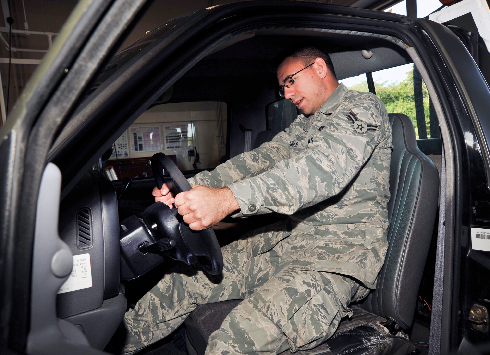 U.S. Air Force Airman 1st Class James Nichols, 35th Logistics Readiness Squadron Vehicle Maintenance Flight, removes a broken steering wheel on a truck used to move ammunition, nitric oxide and missile carts weighing 10 tons or less at Misawa Air Base, Japan, Sept. 30, 2010. The flight is key in supporting Misawa flying missions by also providing logistic support to fighter squadron and aircraft maintenance personnel working on the flightline. (U.S. Air Force photo by Tech. Sgt. Russell McBride/Released)