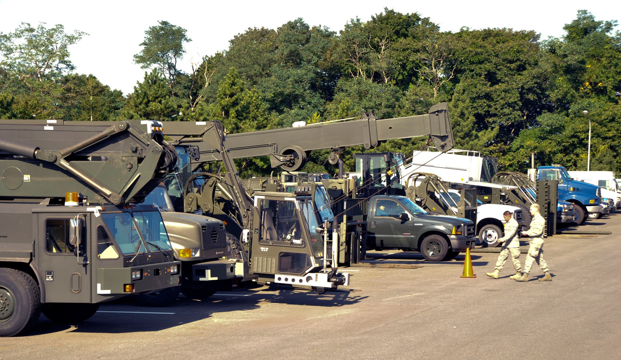 U.S. Air Force members of the 35th Logistics Readiness Squadron Vehicle Maintenance Flight look at vehicles in need of repair or maintenance at Misawa Air Base, Japan, Sept. 30, 2010. The flight provides logistic support to ensure combat-ready forces in support of operations worldwide. (U.S. Air Force photo by Tech. Sgt. Russell McBride/Released)