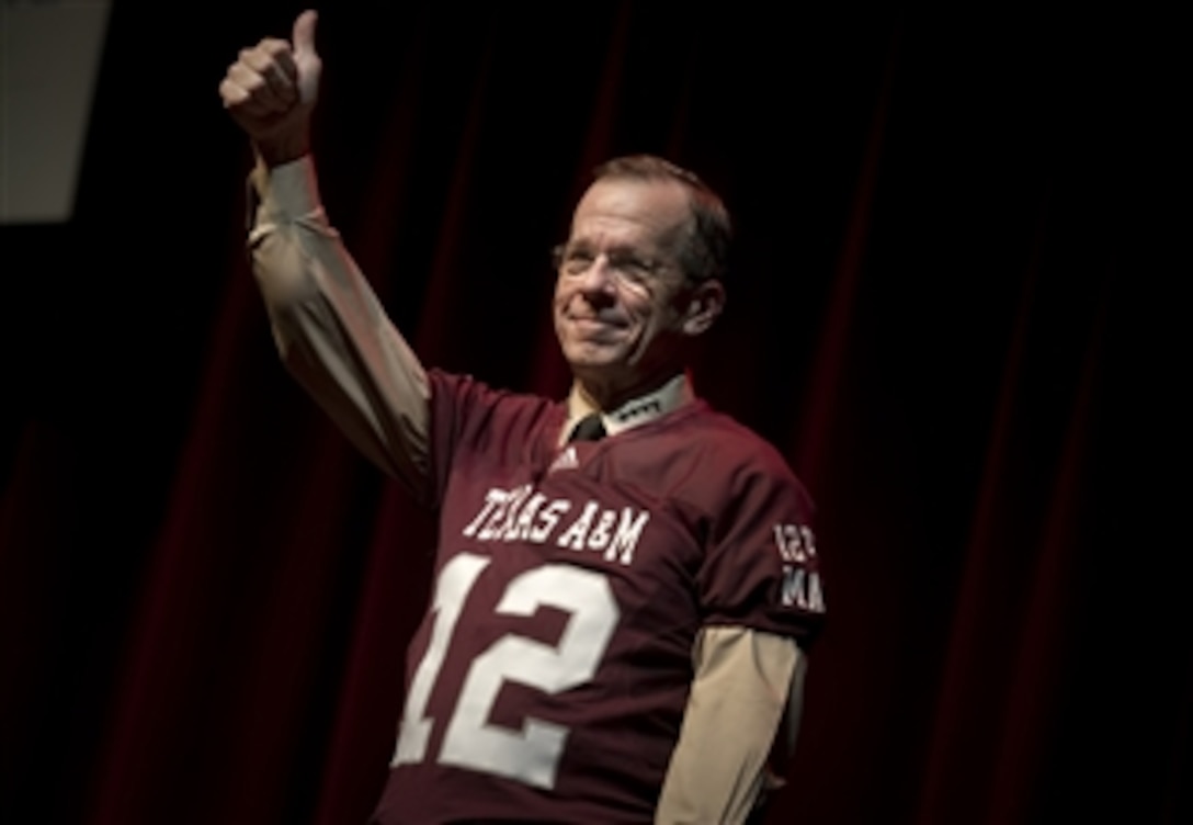 Chairman of the Joint Chiefs of Staff Adm. Mike Mullen gives a thumbs up to Texas A&M University cadets after receiving an Aggies football jersey in College Station, Texas, on Sept. 30, 2010.  