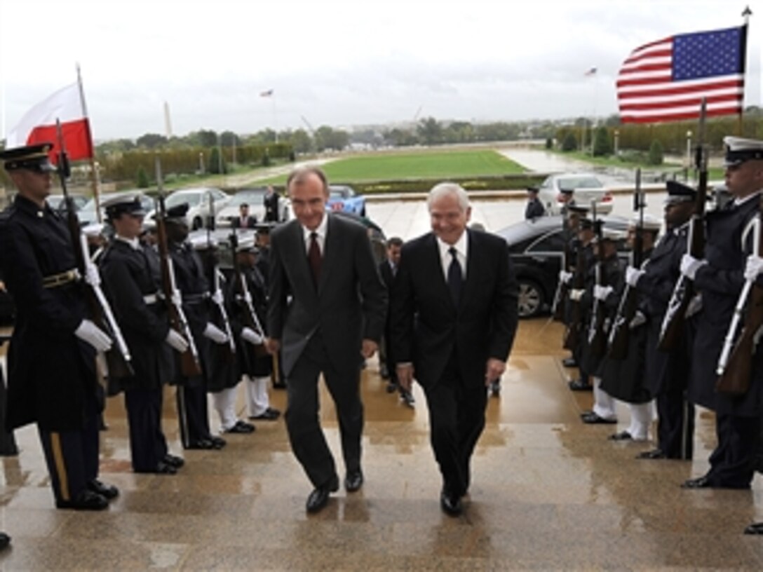 Secretary of Defense Robert M. Gates escorts Polish Minister of Defense Bogdan Klich through an honor cordon and into the Pentagon on Sept. 30, 2010.  