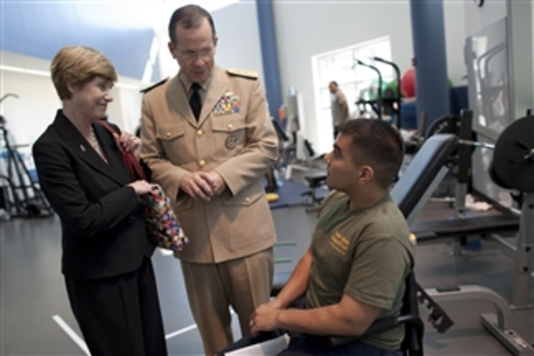 Chairman of the Joint Chiefs of Staff Adm. Mike Mullen, U.S. Navy, and his wife Deborah talk with U.S. Marine Cpl. Raul Olivares during a visit to the Center for the Intrepid in San Antonio, Texas, on Sept. 30, 2010.  