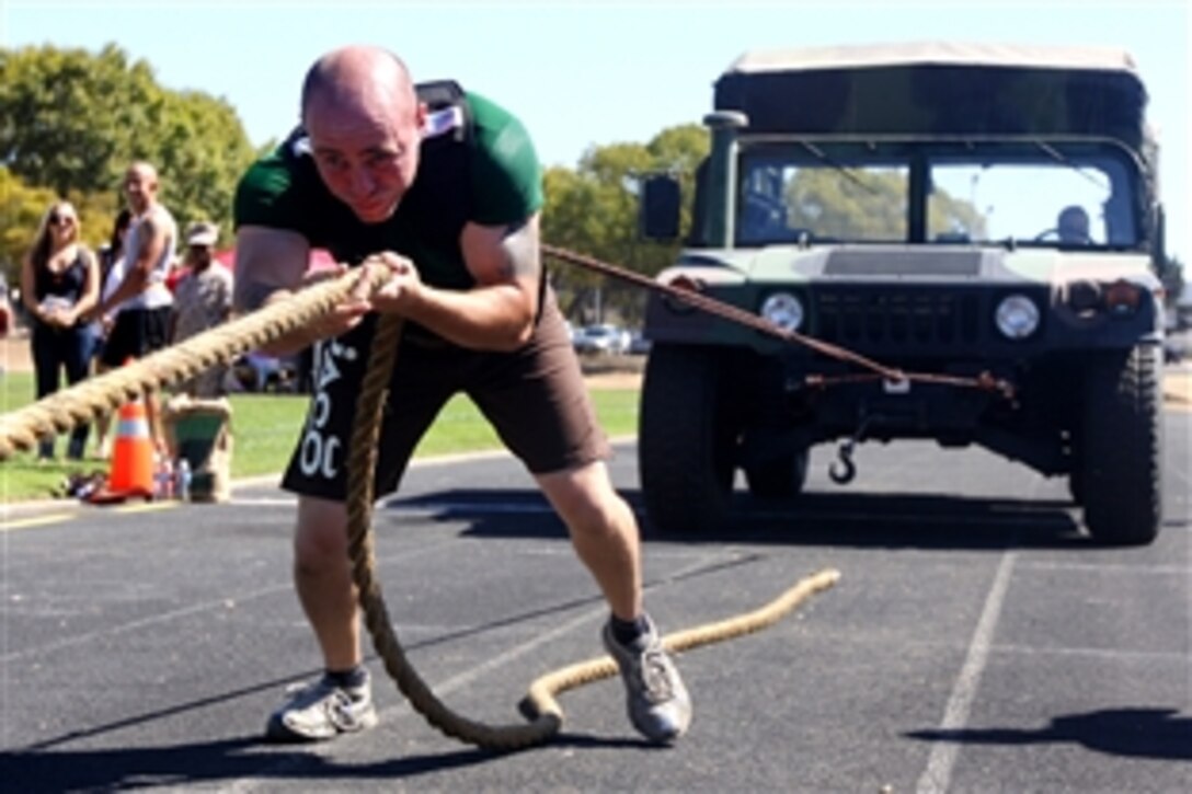 U.S. Marine Corps Cpl. Dillon Campbell pulls a Humvee during Camp Pendleton’s 10th annual Strongest Warrior Competition, U.S. Marine Corps Base Camp Pendleton, Calif., Sept. 24, 2010. The competition is an athletic event in which servicemembers can compete in various timed repetition-measured strength and endurance courses. In addition to the Jeep Pull, the courses included the Tire Flip, the Farmer’s Walk, the Military Press, and a Stone Carry.