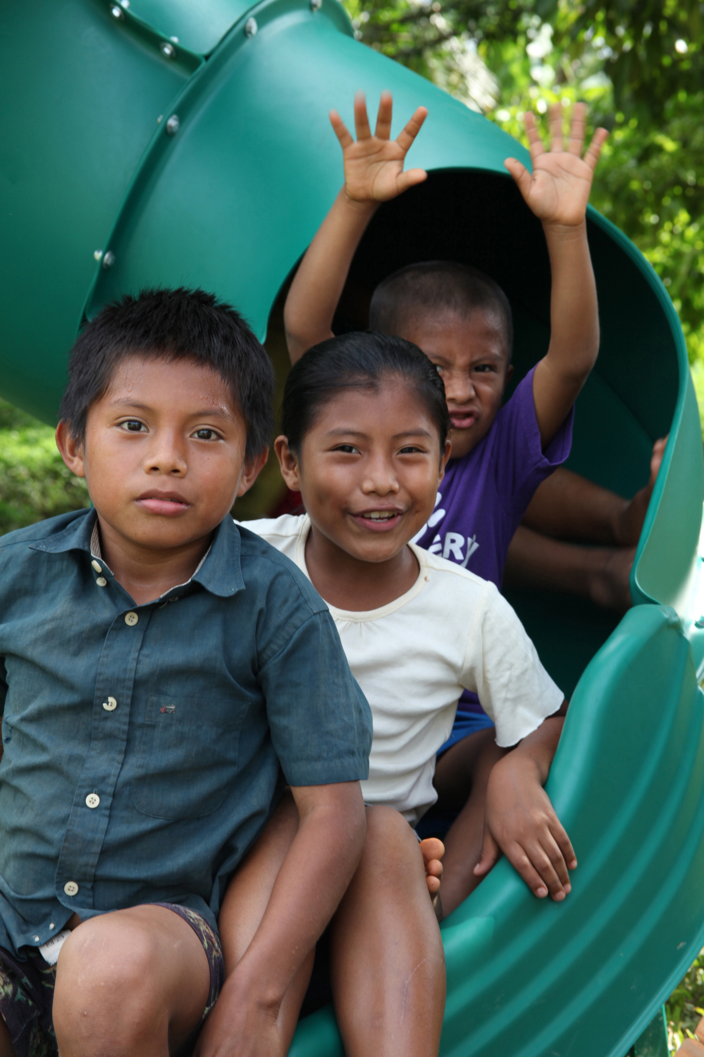 Panamanian children slide down the slide of a playground, Oct. 2, 2010, which was built by Continuing Promise Marines and sailors at an engineer site in Silico Creek, Panama. Marines and sailors of CP10 are anchored off the coast of Chiriqui Grande, Panama, to conduct humanitarian operations. CP10 is a humanitarian civic assistance mission that provides medical, dental, veterinary, engineering support and disaster relief efforts to the Caribbean, Central and South America.