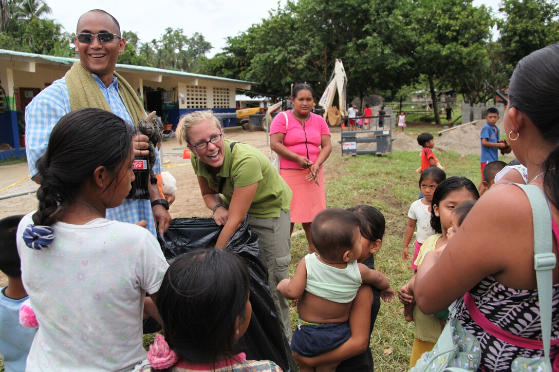 Staff Sgt. Ian F. Llera, a civil affairs specialist with II Marine Expeditionary Force 10th Marines Civil Affairs Detachment, and Marines with non-government organization Give a Kid a Backpack, pass out stuffed animals to children at a school in Grand Chiriqui, Panama, Oct. 5. Three civil affairs Marines from II MEF 10th Marines Civil Affairs Detachment have deployed with CP10, a humanitarian civic assistance mission that provides medical, dental, veterinary, engineering support and disaster relief efforts to the Caribbean, Central and South America. Llera hails from Avon, Conn.